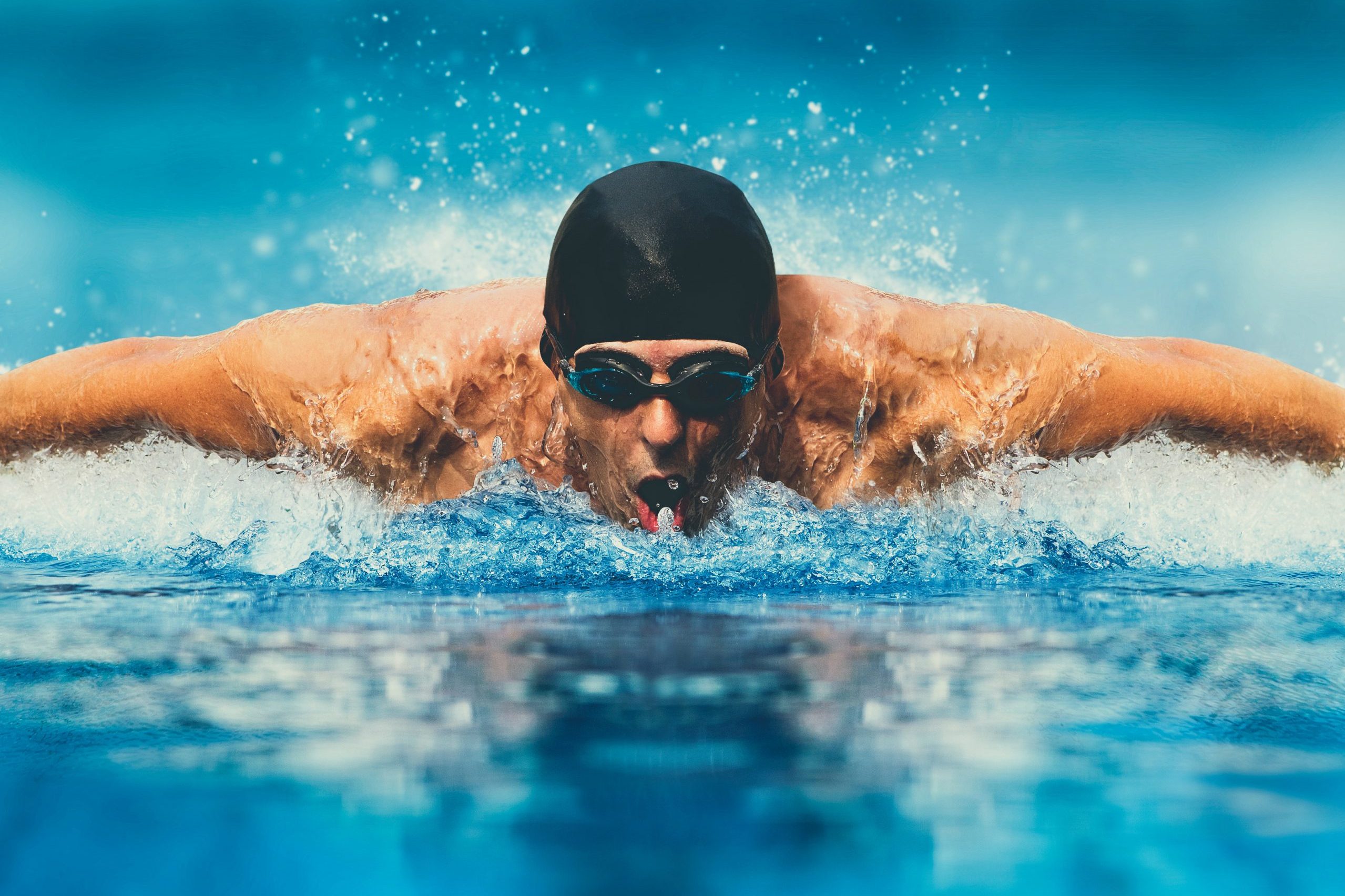 Man in swimming pool. Butterfly style. Matte effect